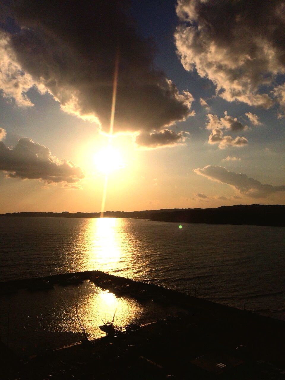 sun, water, sunset, tranquil scene, sky, scenics, reflection, tranquility, sea, beauty in nature, sunlight, cloud - sky, sunbeam, nature, idyllic, beach, horizon over water, cloud, silhouette, shore