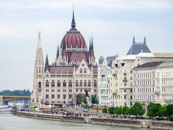 View of buildings in city against sky