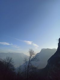 Scenic view of silhouette mountains against sky