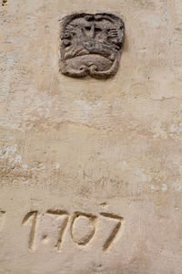 Close-up of human sculpture on wall