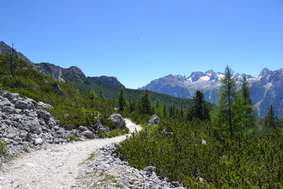 Scenic view of mountains against clear blue sky