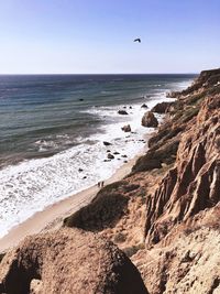 Scenic view of beach against clear sky