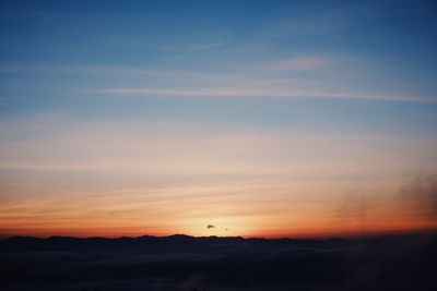 Scenic view of silhouette landscape against sky during sunset