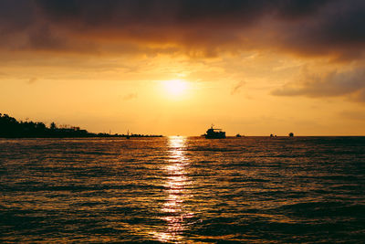 Scenic view of sea against sky during sunset