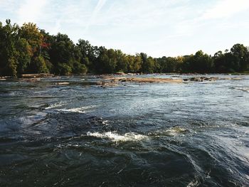 Scenic view of river against sky