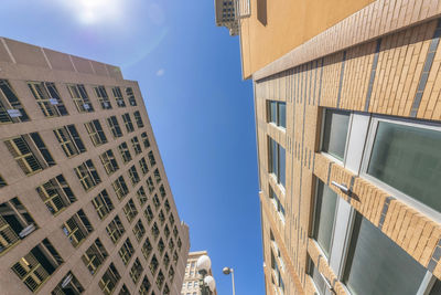 Low angle view of modern buildings against sky