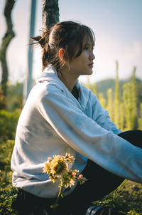 Beautiful woman with red flower