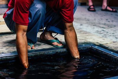 Low section of woman in water