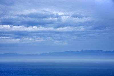 Scenic view of sea against cloudy sky