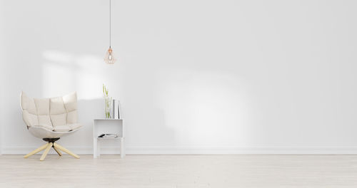 Table and chairs on floor against wall at home