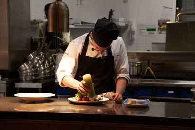 Man preparing food in kitchen