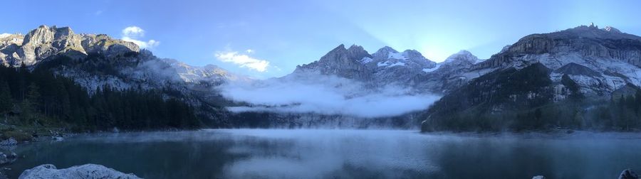 Panoramic view of lake and mountains against sky