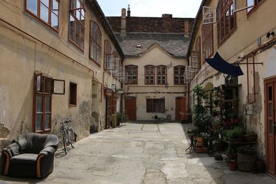 Empty alley amidst buildings in town