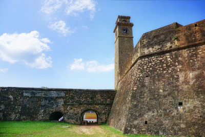 Low angle view of historic building against sky