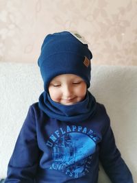 Full length of cute boy wearing hat during winter