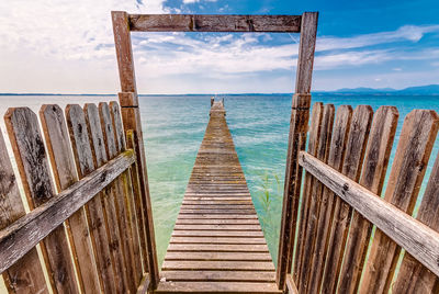 Pier over sea against sky