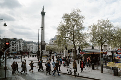 People walking on street in city