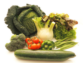 Close-up of vegetables over white background