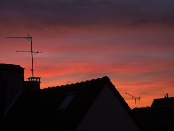 Low angle view of building against sky at sunset