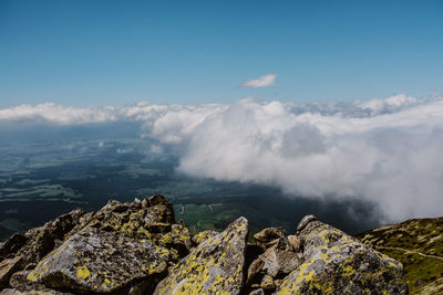 Scenic view of sea and mountains against sky