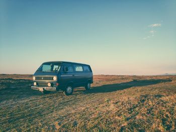 View of car on field against clear sky