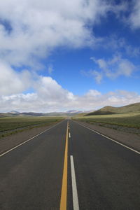 Empty road passing through landscape