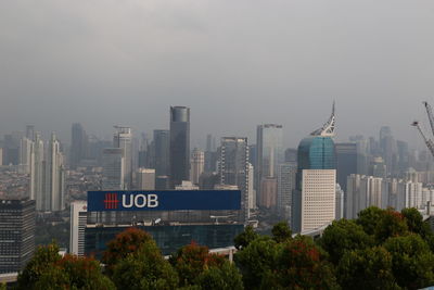 Modern buildings in city against sky