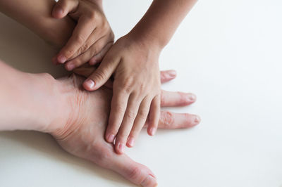 Close-up of hands touching baby