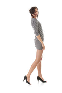 Full length of woman standing against white background
