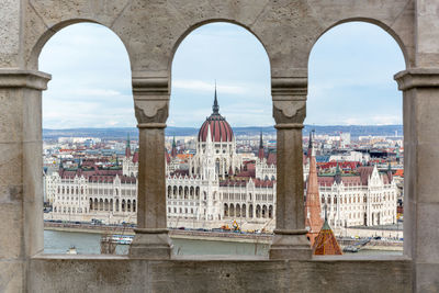 Buildings in city against sky