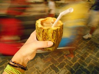 Close-up of hand holding drink