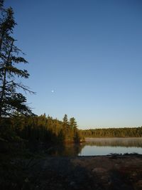 Scenic view of calm lake against clear sky