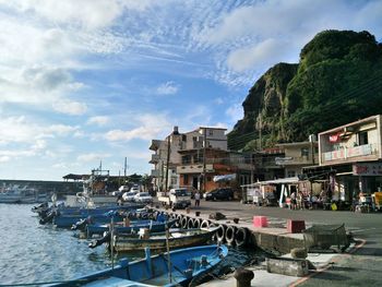 Boats moored at harbor