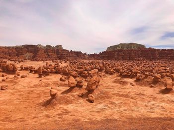 Rock formations in desert against sky