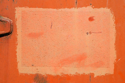 Full frame shot of stained orange wall