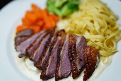 Close-up of noodles served in plate