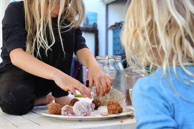 Girls preparing food in kitchen at home