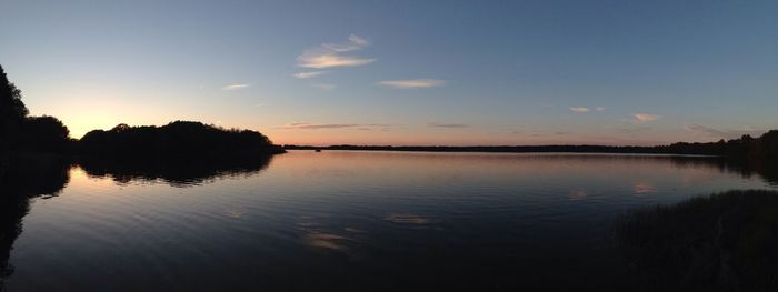 Scenic view of lake at sunset