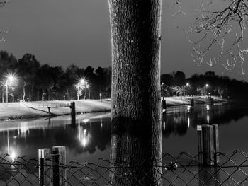 Scenic view of lake against sky at night