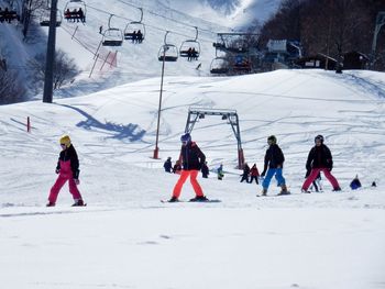 Group of people on snow covered field