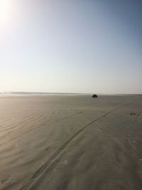 Scenic view of beach against clear sky