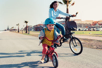 Portrait of smiling woman riding bicycle