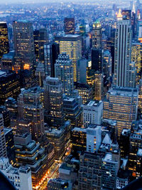 High angle view of city lit up at night