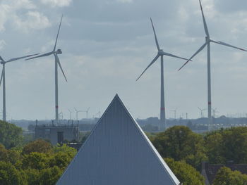 Panoramic view of wind turbine against sky