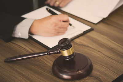 Close-up of person using laptop on table