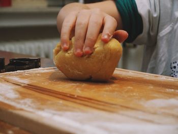 Close-up of person preparing food on cutting board