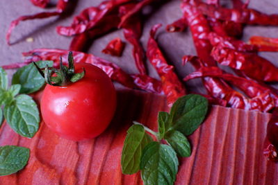 Close-up of red chili peppers on table