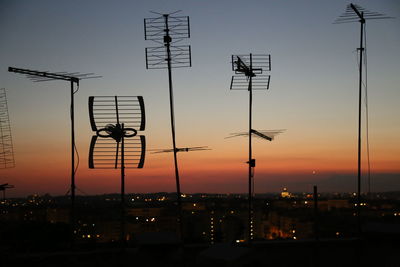 View of illuminated street lights at night