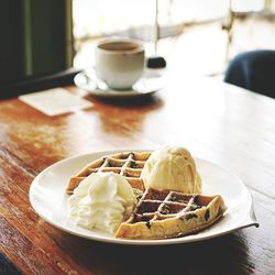 High angle view of dessert served on wooden table