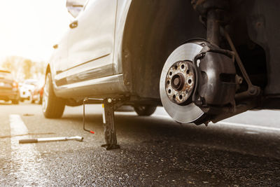 Close-up of car on road